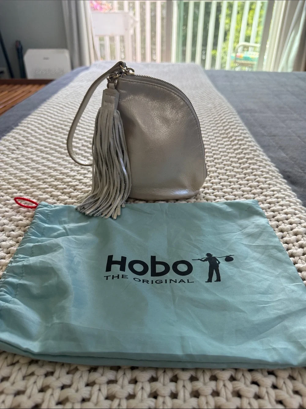 Hobo Pebbled Leather Tassel Wristlet - Silver